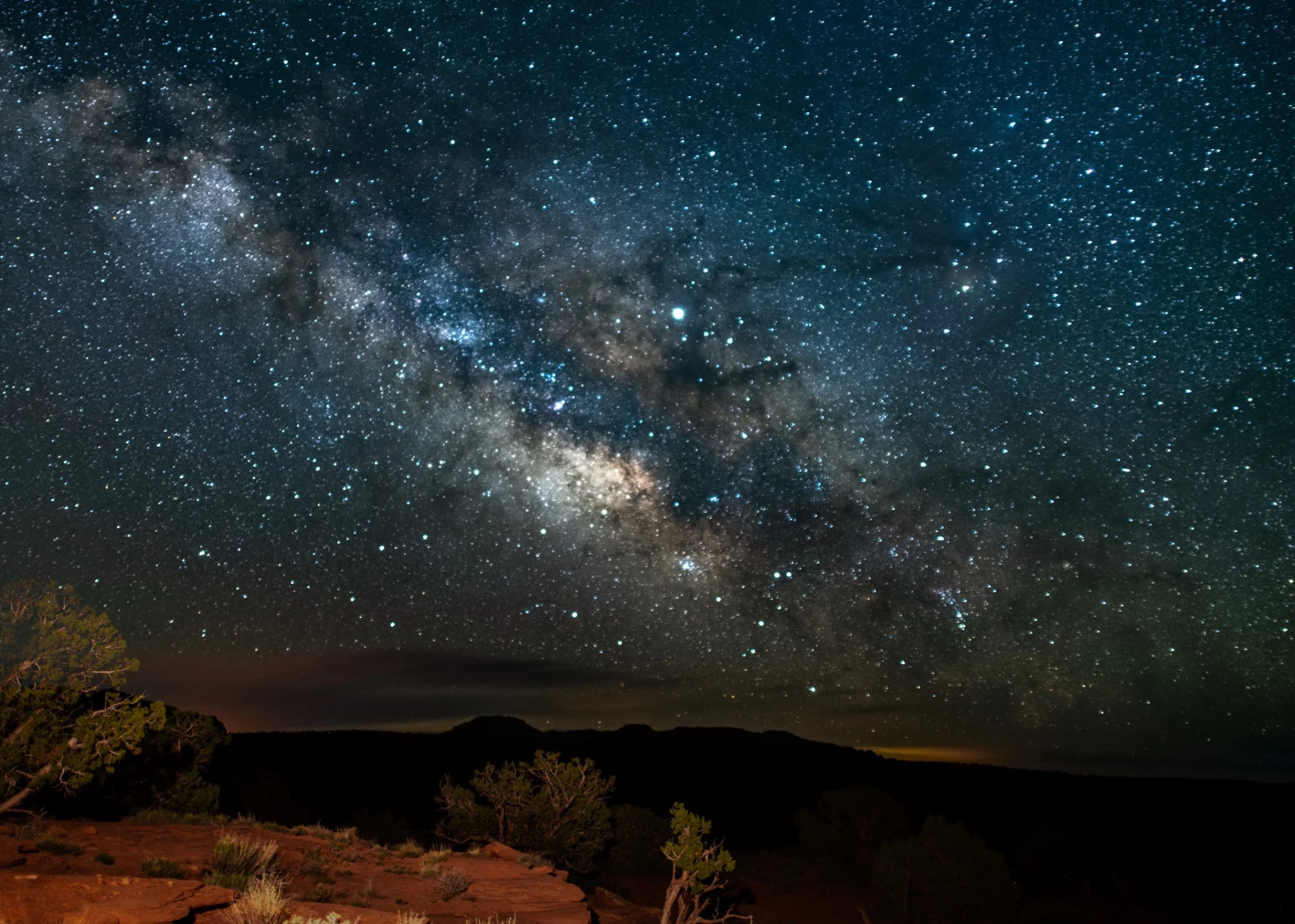 The Milky Way rising over a desert rock formation near Moab